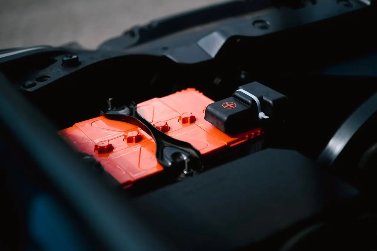 Close-up of a car battery in an engine bay