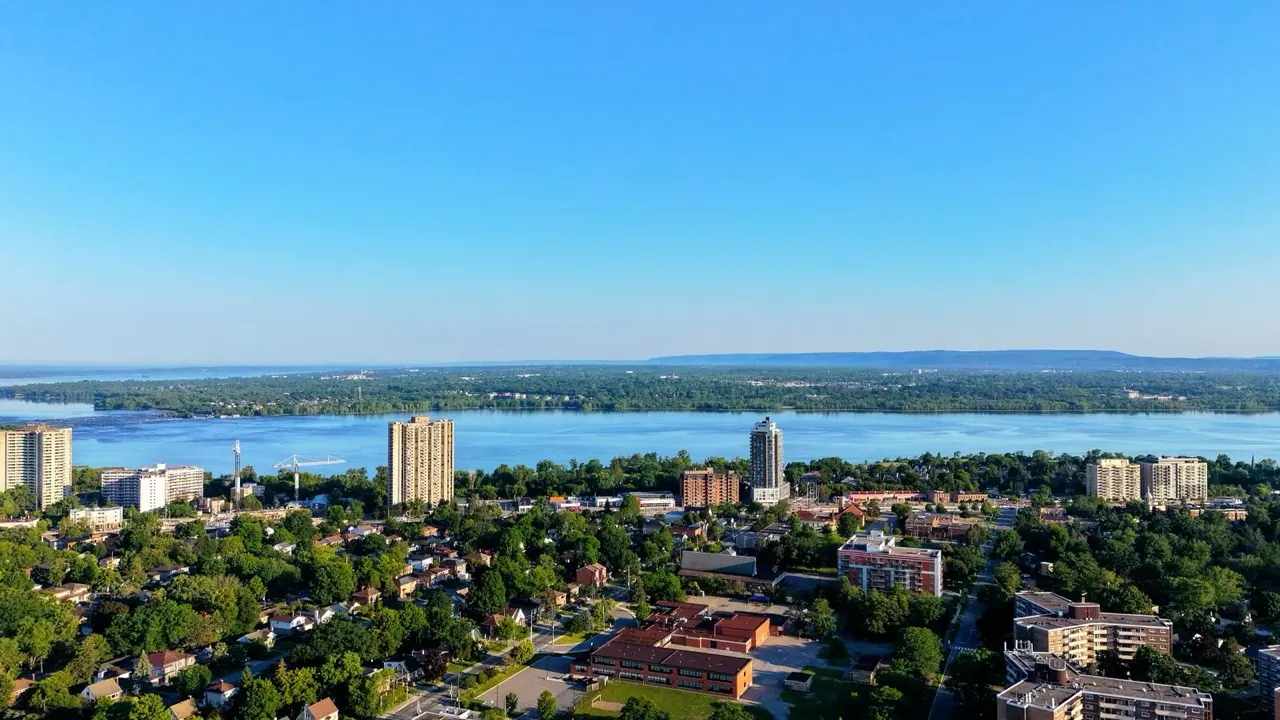 An aerial view of Hamilton, Ontario, and the lake beyond on a sunny day
