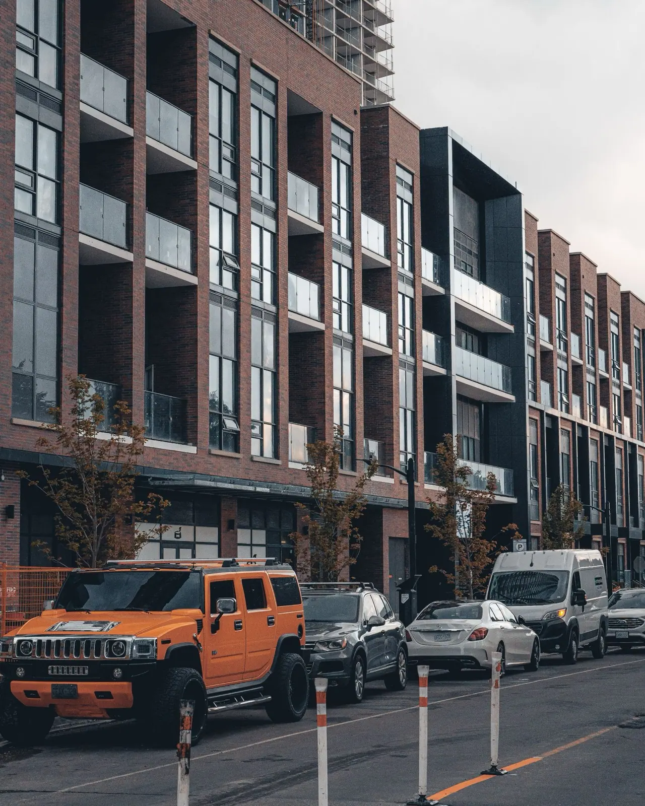 Condo buildings and parked cars on a street in Mississauga
