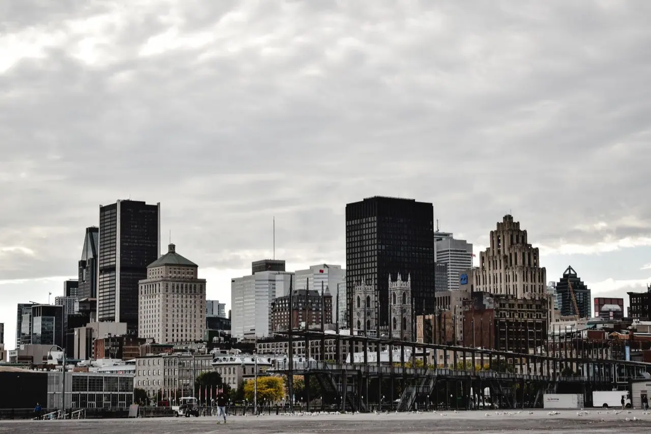 Downtown Montreal towers under a grey sky